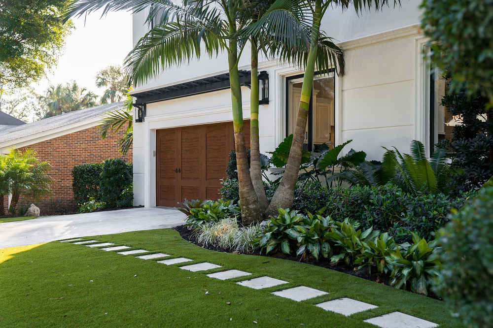 gardnen beds next to driveway and front walkway 